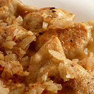 Pierogi with meat sprinkled with fried onion