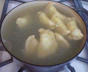 Boiling pierogi in a salted water