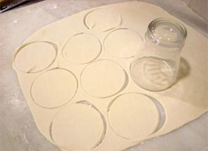Cutting circles out of pierogi dough