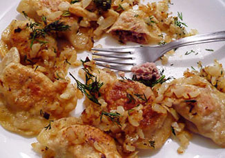 Plateful of Polish pierogi with meat aka forcemeat