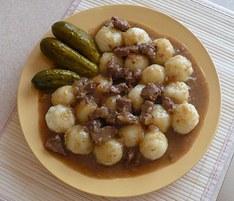 Silesian dumplings with beef sauce