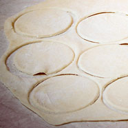 Pierogi dough cutting.