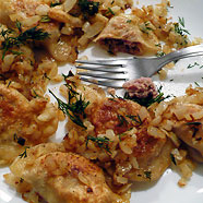Eating pierogi with meat
