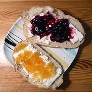 Two sandwiches with sweet curd cheese and jam